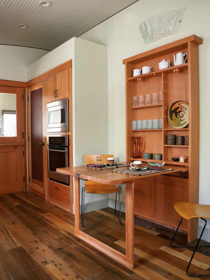 Откидной обеденный стол в виде пристенного шкафа поможет сэкономить пространство в значительной степени
