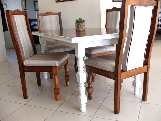 Nice-Dining-Table-Design-closed-Cushioned-Kitchen-Chairs-on-Simple-Floortile-and-Plain-Wall-Paint-plus-Picture-Decor-inside-Simple-Room-1208x906