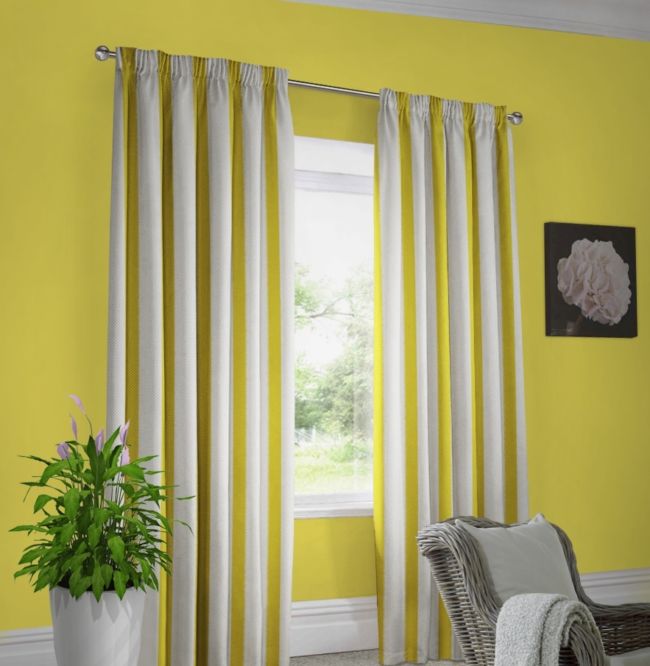 Yellow walls white curtains in dark yellow stripes