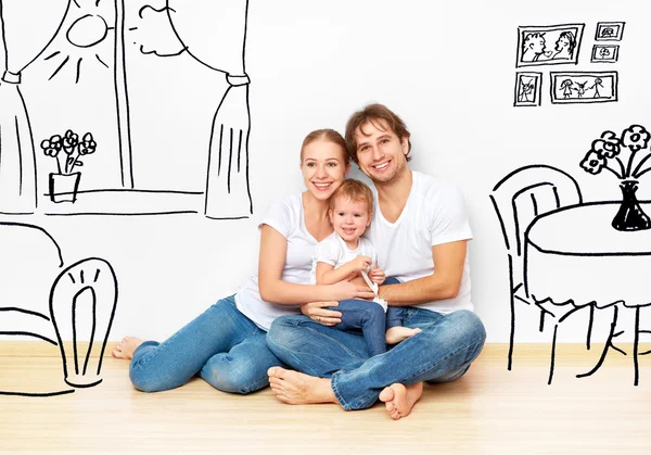 Понятие: счастливая молодая семья в новой мечте квартиры и интерьере плана — стоковое фото
