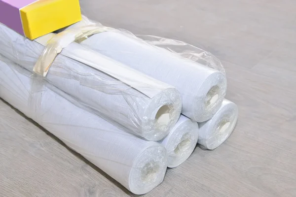 Wallpapering ( rolls of wallpaper ) — стоковое фото