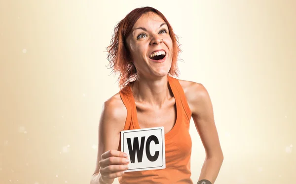 Женщина с Wc знак — стоковое фото