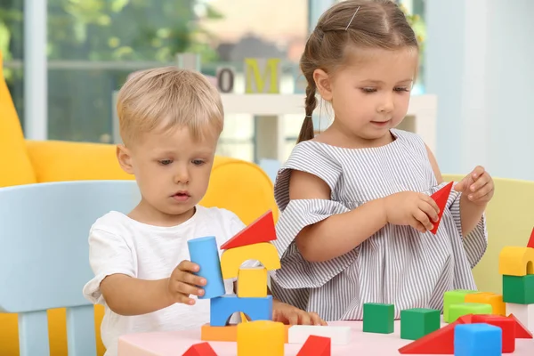 Cute Children Playing Constructor Table Home — стоковое фото