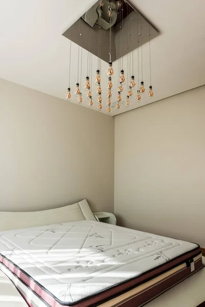 Interior Stylish Bedroom Bed Light Bulbs Ceiling — стоковое фото