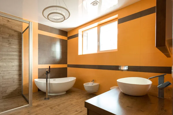 Interior Bathroom Orange White Colors Bathtube Sink Bidet — стоковое фото
