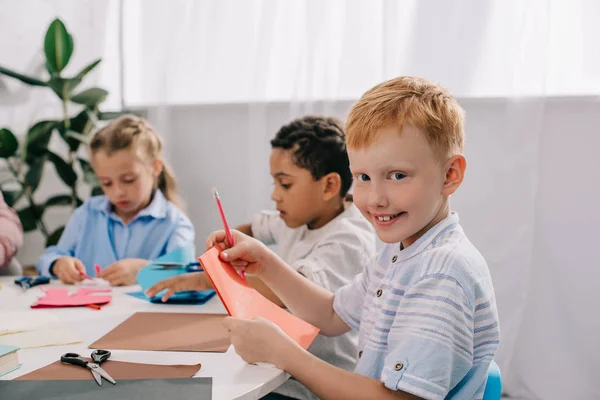 Adorable Multicultural Kids Making Paper Applique Classroom — стоковое фото