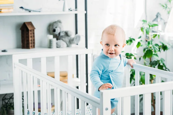 Happy Little Baby Standing Crib Home — стоковое фото
