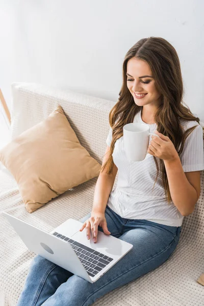 High Angle View Female Freelancer Coffee Cup Working Laptop Couch — стоковое фото