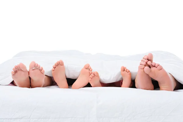 Parents Kids Feet Bed White Blanket Isolated White — стоковое фото