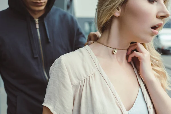 Cropped View Robber Attacking Woman Stealing Pendant Street — стоковое фото