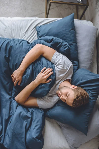 Overhead View Young Handsome Man Sleeping Blanket His Bed Home — стоковое фото