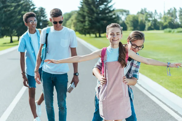 Happy Multiethnic Teenage Friends Having Fun While Walking Together Park — стоковое фото