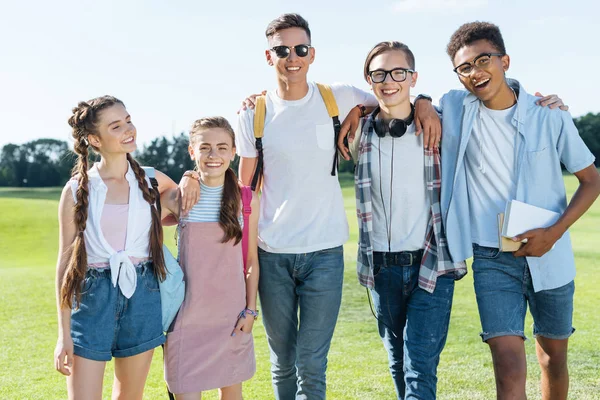 Happy Multiethnic Teenage Friends Standing Together Smiling Camera Park — стоковое фото